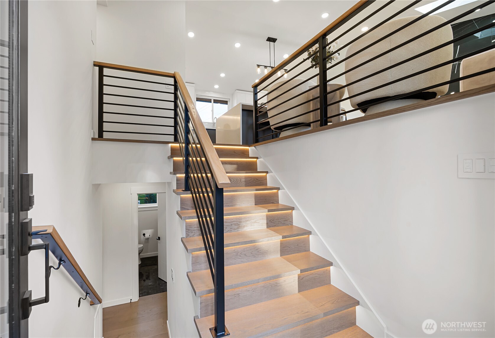 4215 228th Street Southeast Bothell, WA 98021 - Photo 23 of 36 a view of entryway and hall with wooden floor