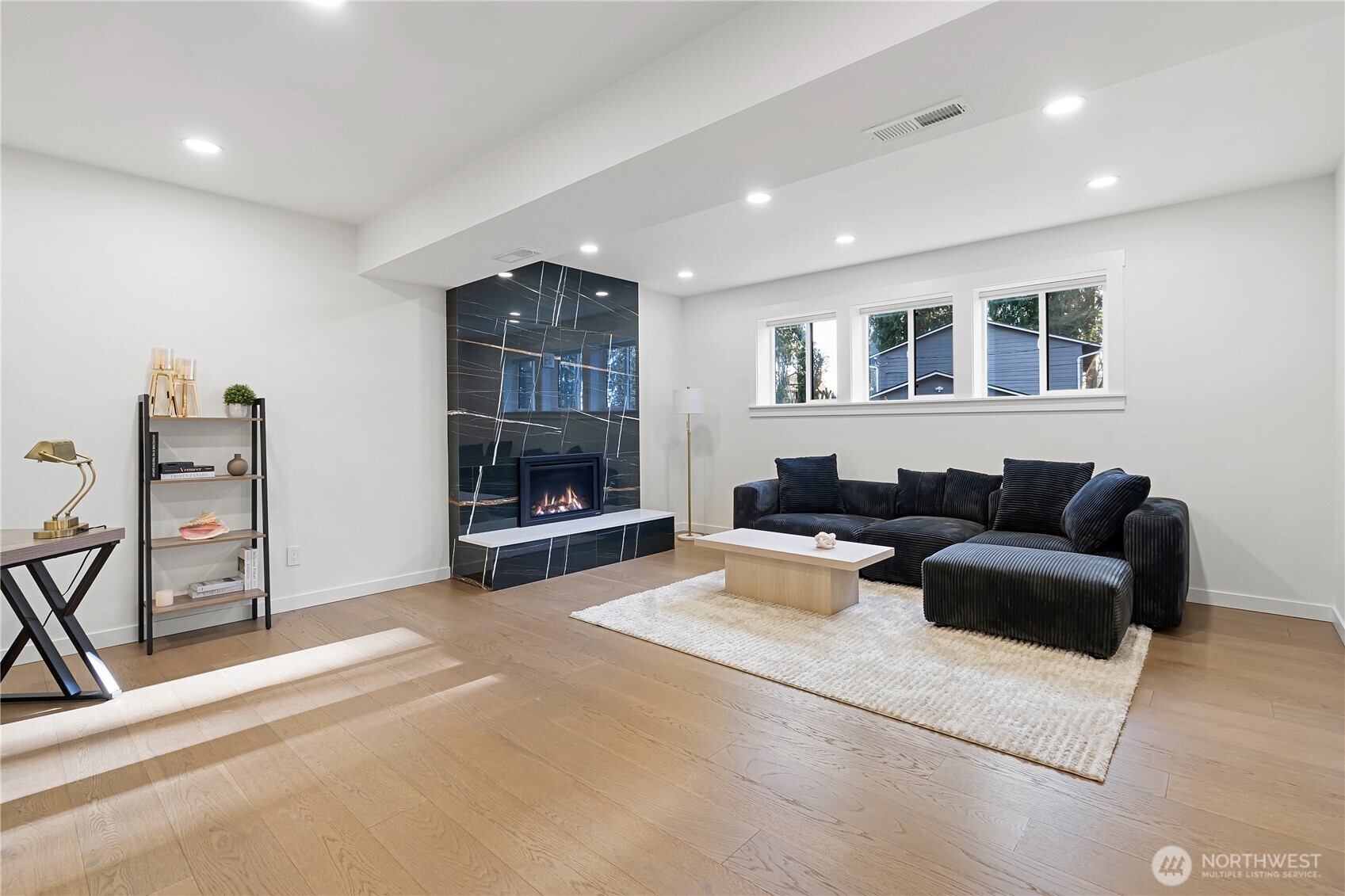 4215 228th Street Southeast Bothell, WA 98021 - Photo 24 of 36 a living room with furniture and a flat screen tv