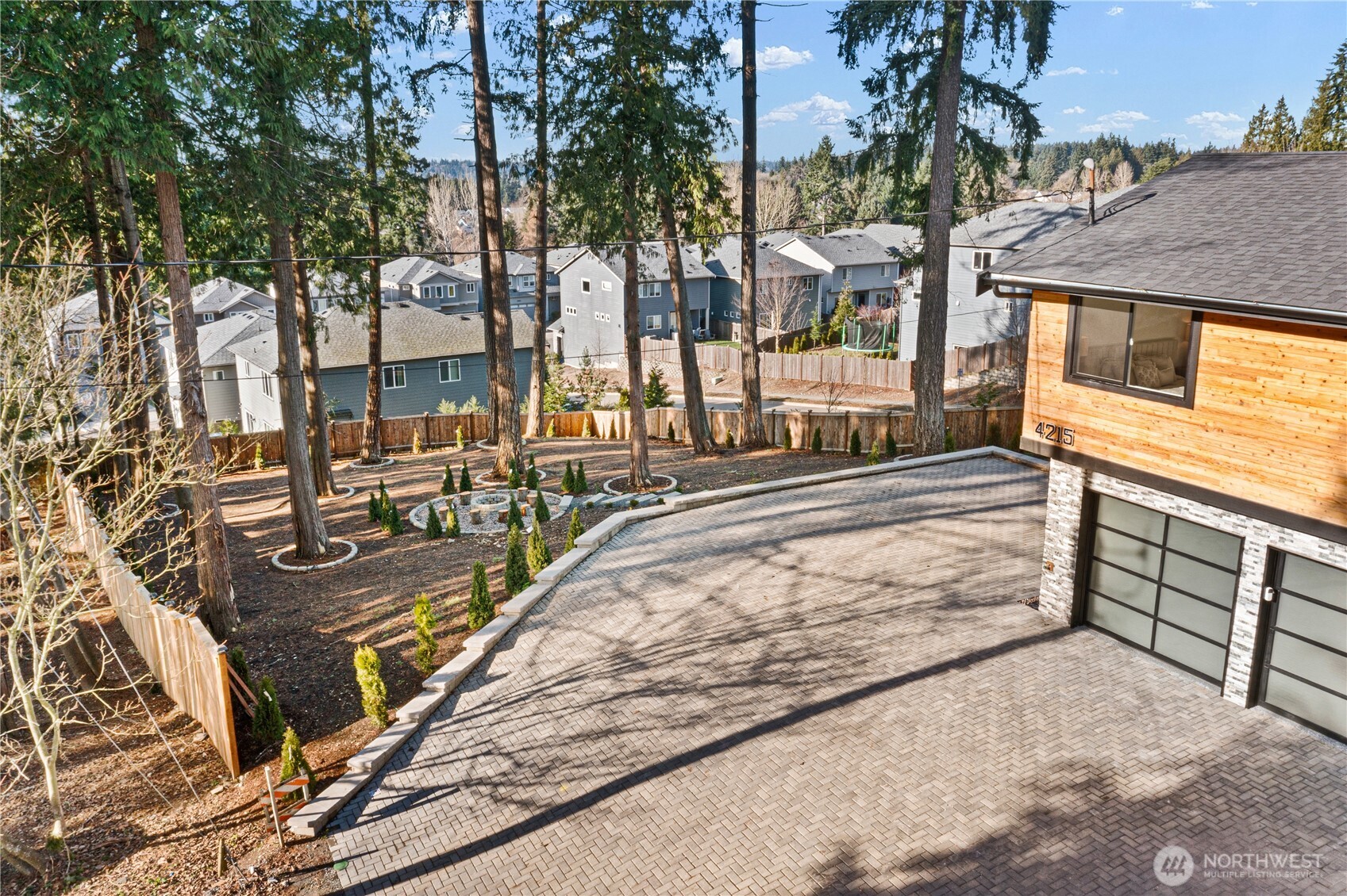 4215 228th Street Southeast Bothell, WA 98021 - Photo 34 of 36 a view of a house with cars park
