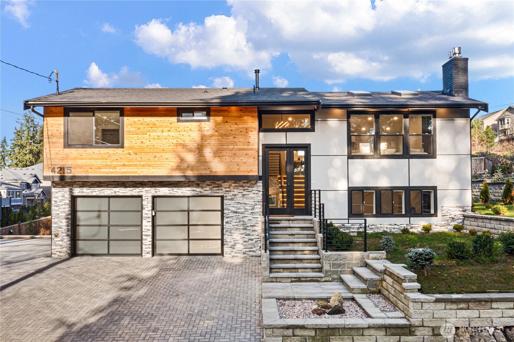 4215 228th Street Southeast Bothell, WA 98021 - Photo 36 of 36 a front view of a house with a garden
