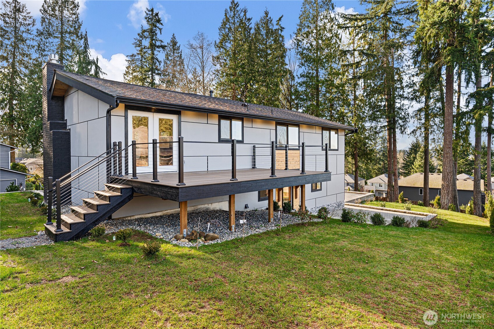4215 228th Street Southeast Bothell, WA 98021 - Photo 7 of 36 front view of a house with a yard table and chairs