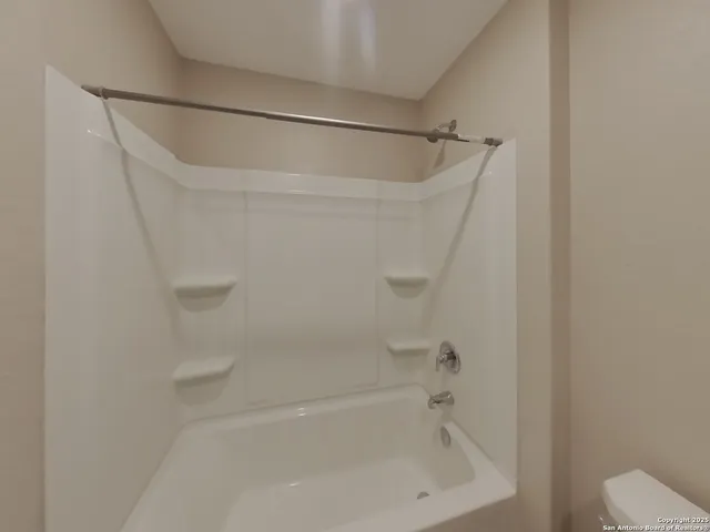 a close view of a bathtub in bathroom