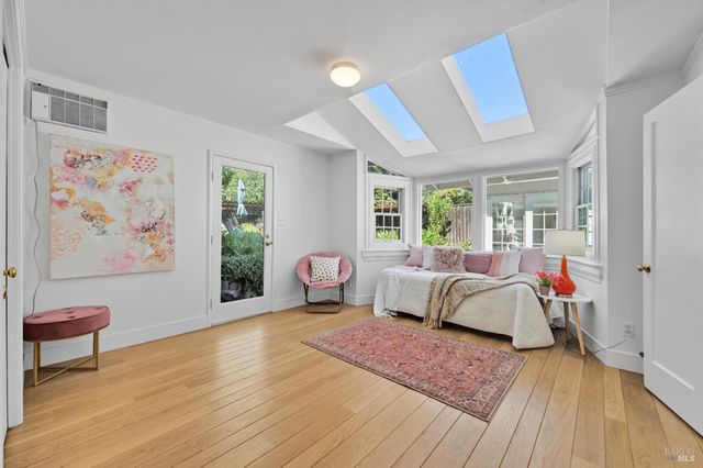 a spacious bedroom with a bed and a couch