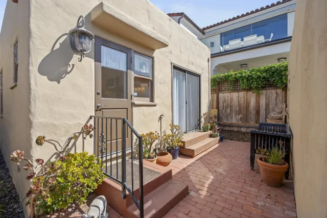 a view of balcony with furniture