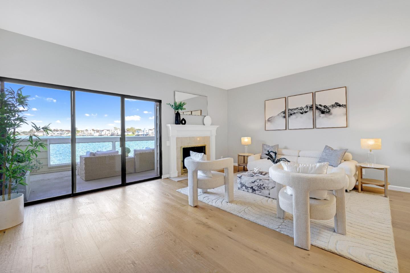 a living room with furniture and a floor to ceiling window