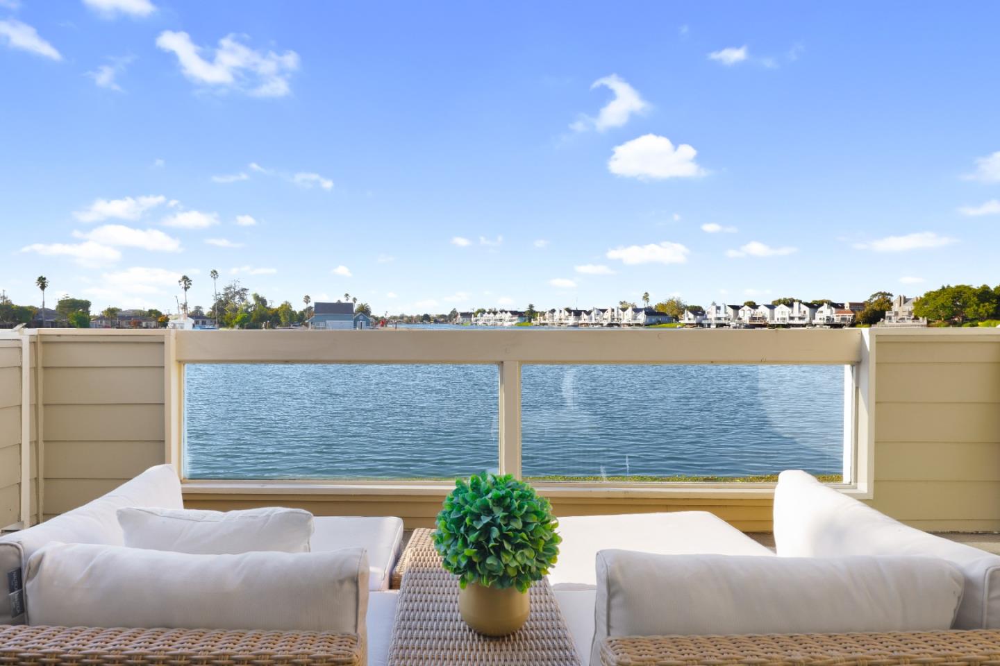 972 Shoreline Drive San Mateo, CA 94404 - Photo 2 of 64 a view of a lake with couches chairs
