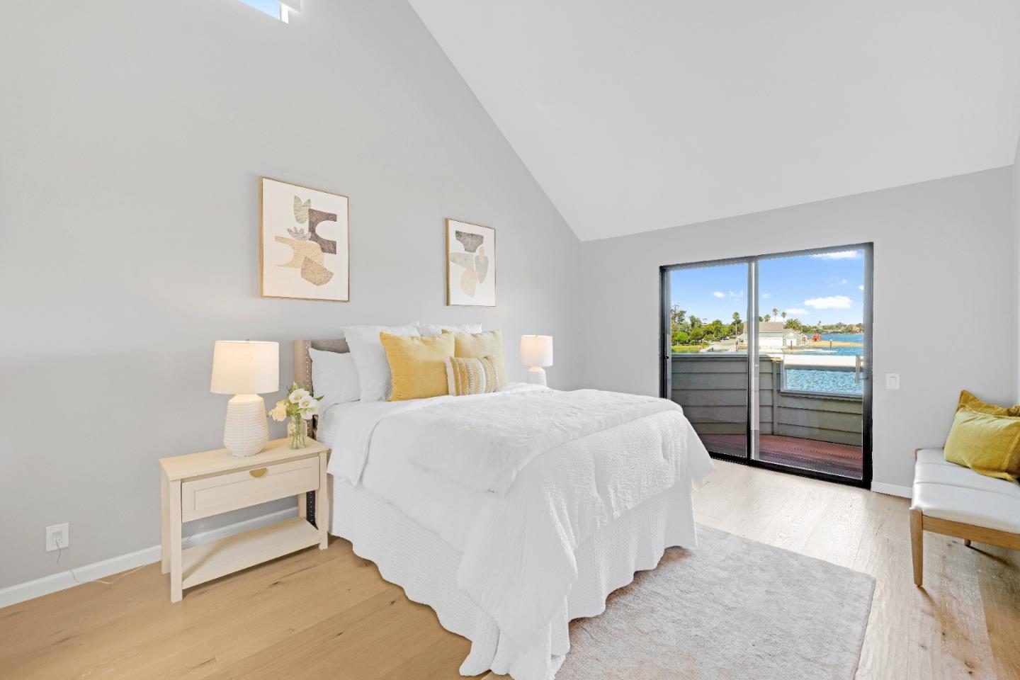 972 Shoreline Drive San Mateo, CA 94404 - Photo 30 of 64 a bedroom with a bed and wooden floor