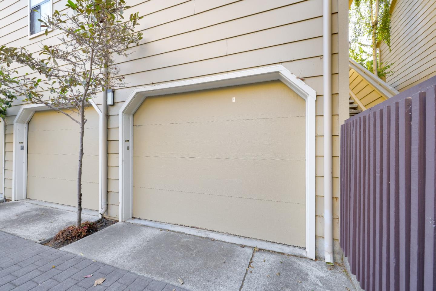 972 Shoreline Drive San Mateo, CA 94404 - Photo 41 of 64 a side view of a house with a garage