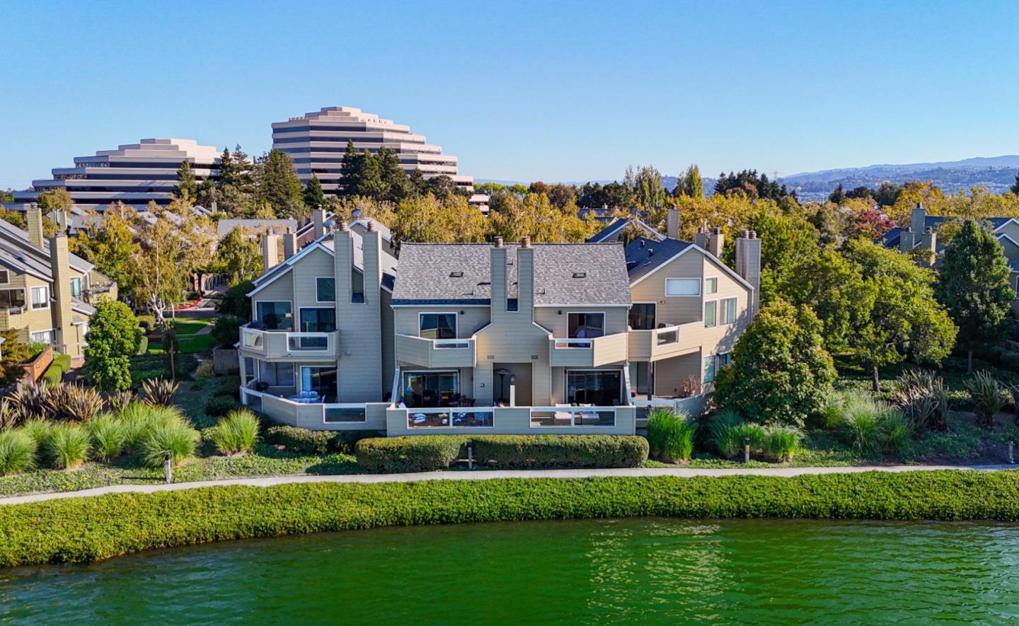 972 Shoreline Drive San Mateo, CA 94404 - Photo 54 of 64 a front view of a house with a garden