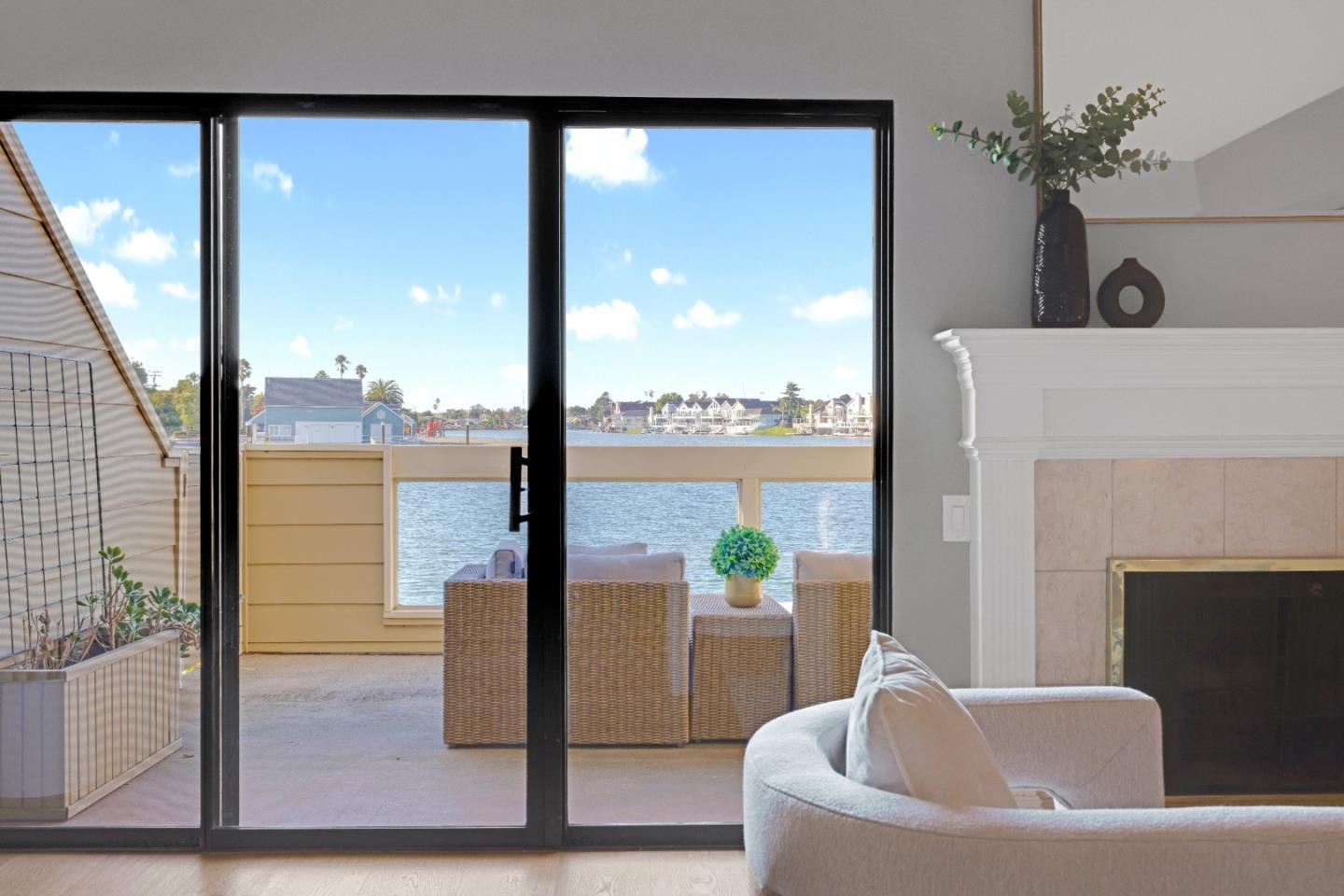 972 Shoreline Drive San Mateo, CA 94404 - Photo 9 of 64 a view of a balcony with lake view and a potted plant