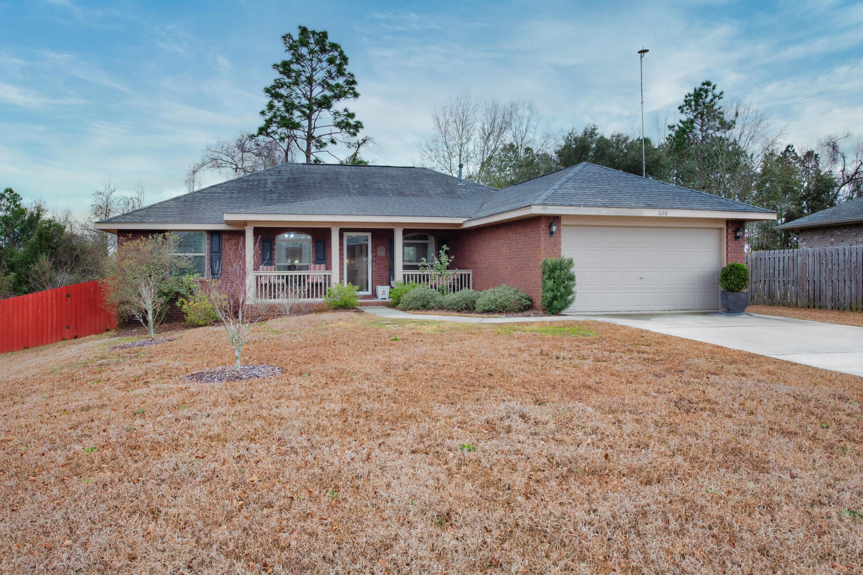 1680 Twin Pines Circle Cantonment, FL 32533 - Photo 1 of 39 front view of a house with a yard