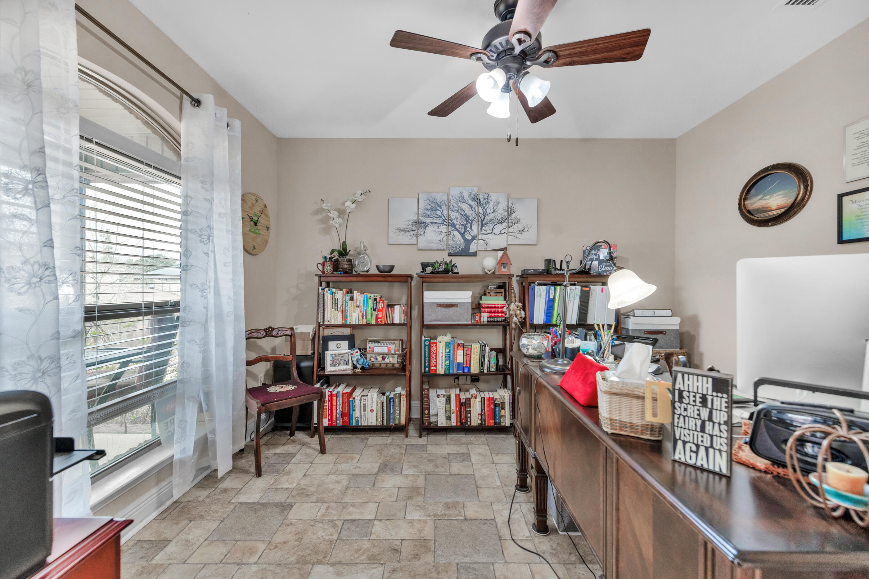 1680 Twin Pines Circle Cantonment, FL 32533 - Photo 16 of 39 a view of a workspace with furniture