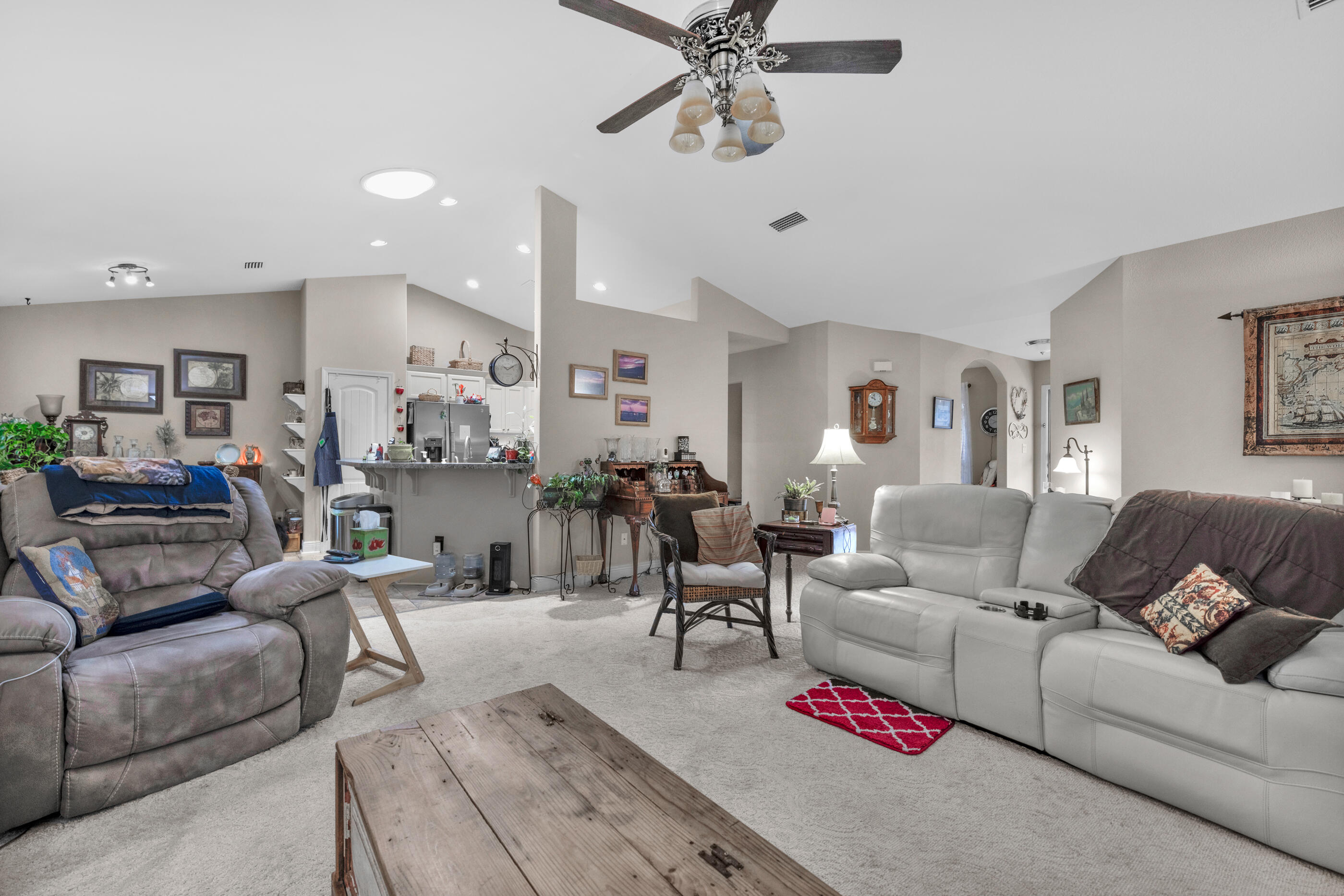 1680 Twin Pines Circle Cantonment, FL 32533 - Photo 18 of 39 a living room with furniture kitchen view and a chandelier