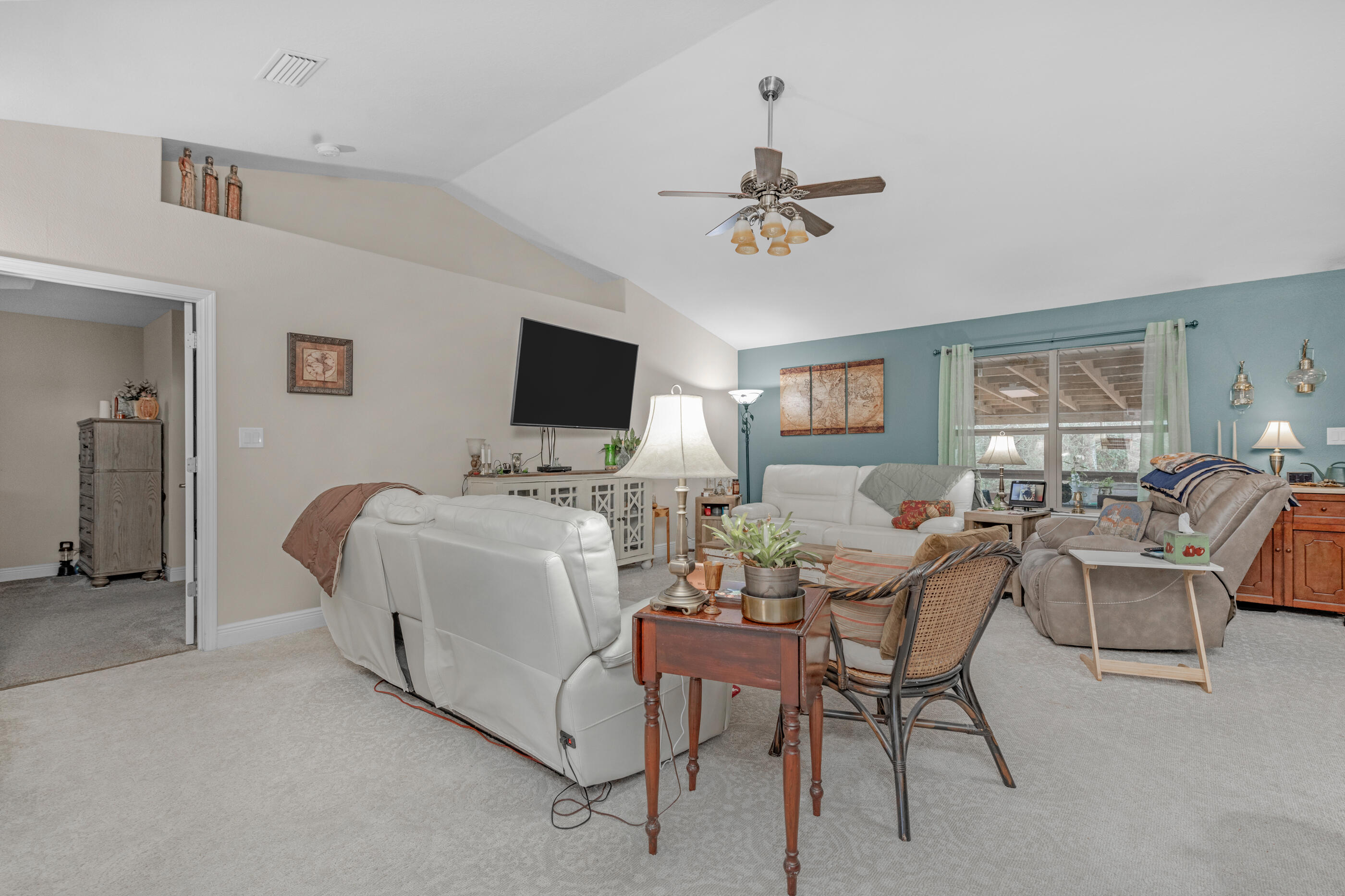 1680 Twin Pines Circle Cantonment, FL 32533 - Photo 20 of 39 a living room with furniture and a flat screen tv