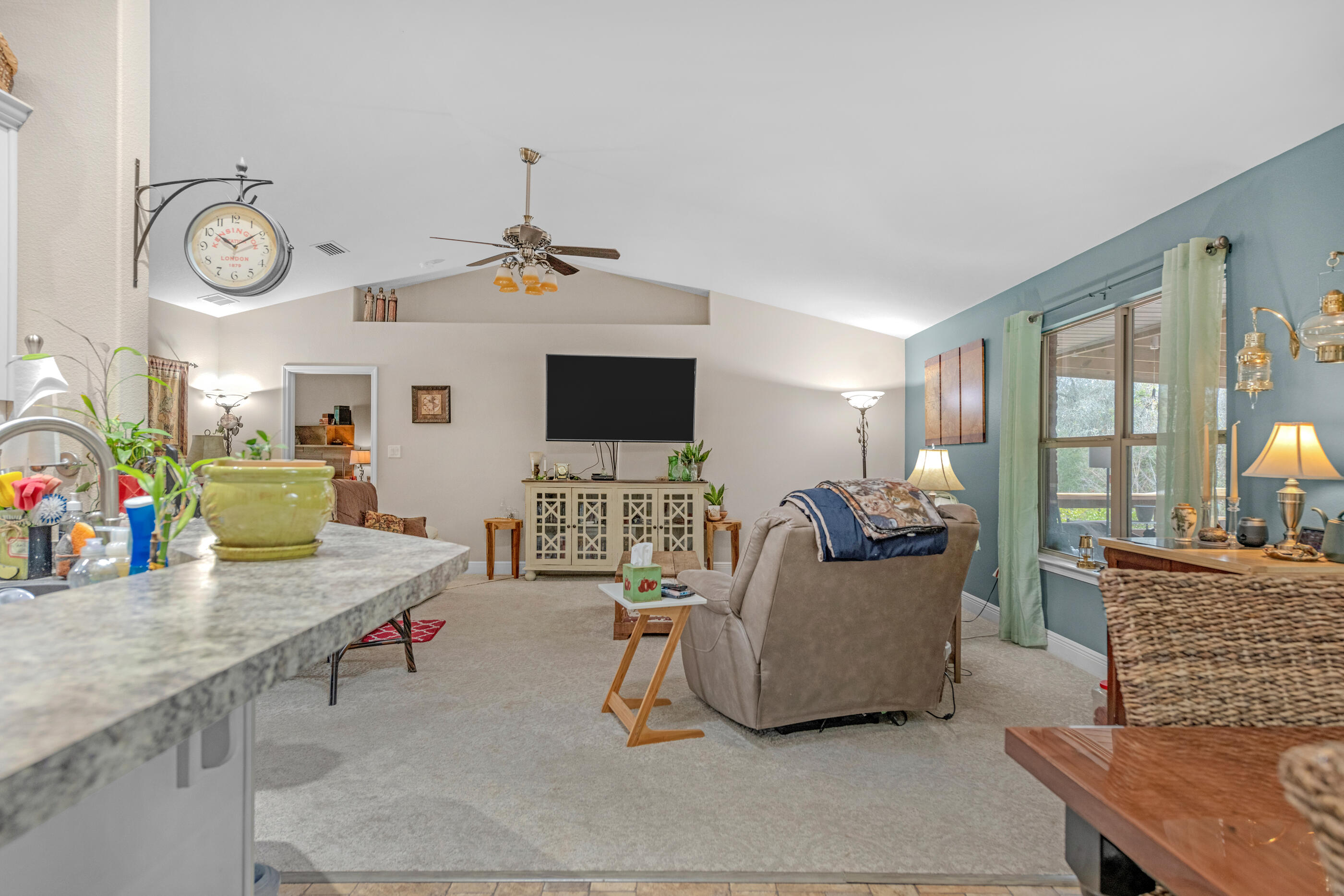 1680 Twin Pines Circle Cantonment, FL 32533 - Photo 21 of 39 a living room with furniture and a flat screen tv
