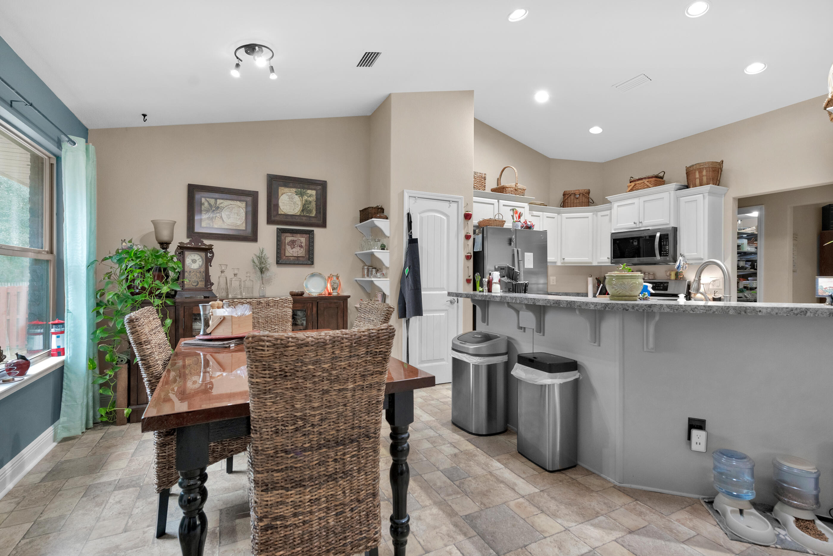 1680 Twin Pines Circle Cantonment, FL 32533 - Photo 22 of 39 a kitchen with stainless steel appliances granite countertop sink stove and refrigerator