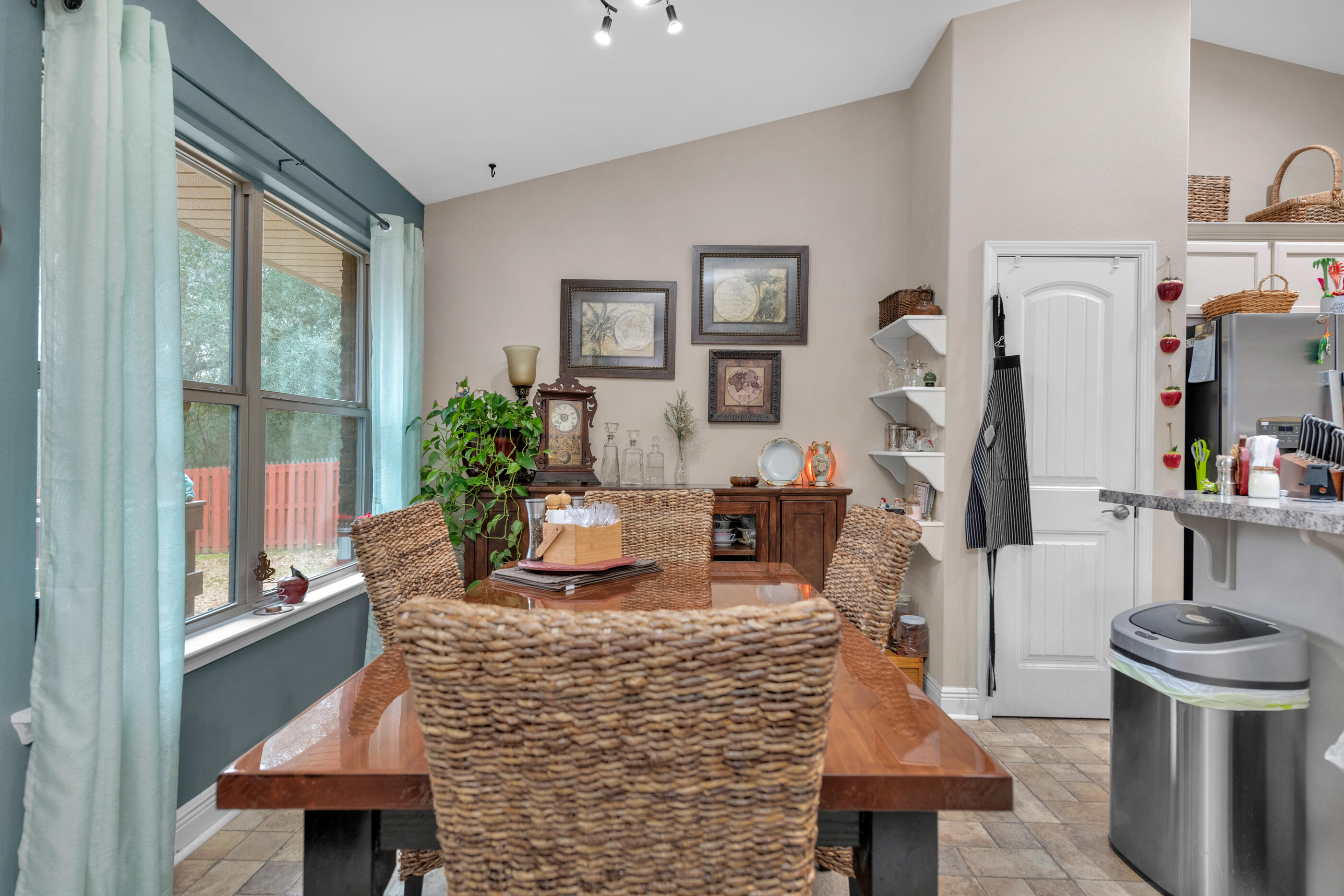 1680 Twin Pines Circle Cantonment, FL 32533 - Photo 24 of 39 a living room with furniture a fireplace and a large window