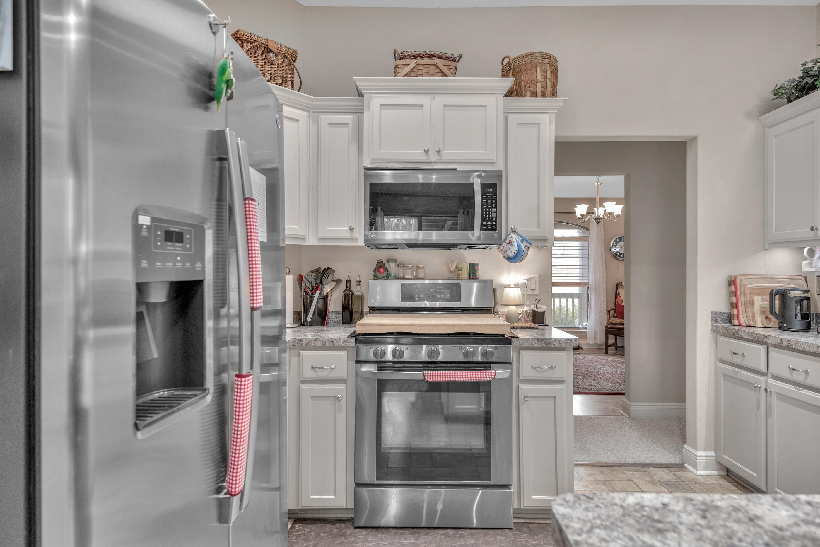 1680 Twin Pines Circle Cantonment, FL 32533 - Photo 26 of 39 a kitchen with stainless steel appliances granite countertop a stove and a refrigerator