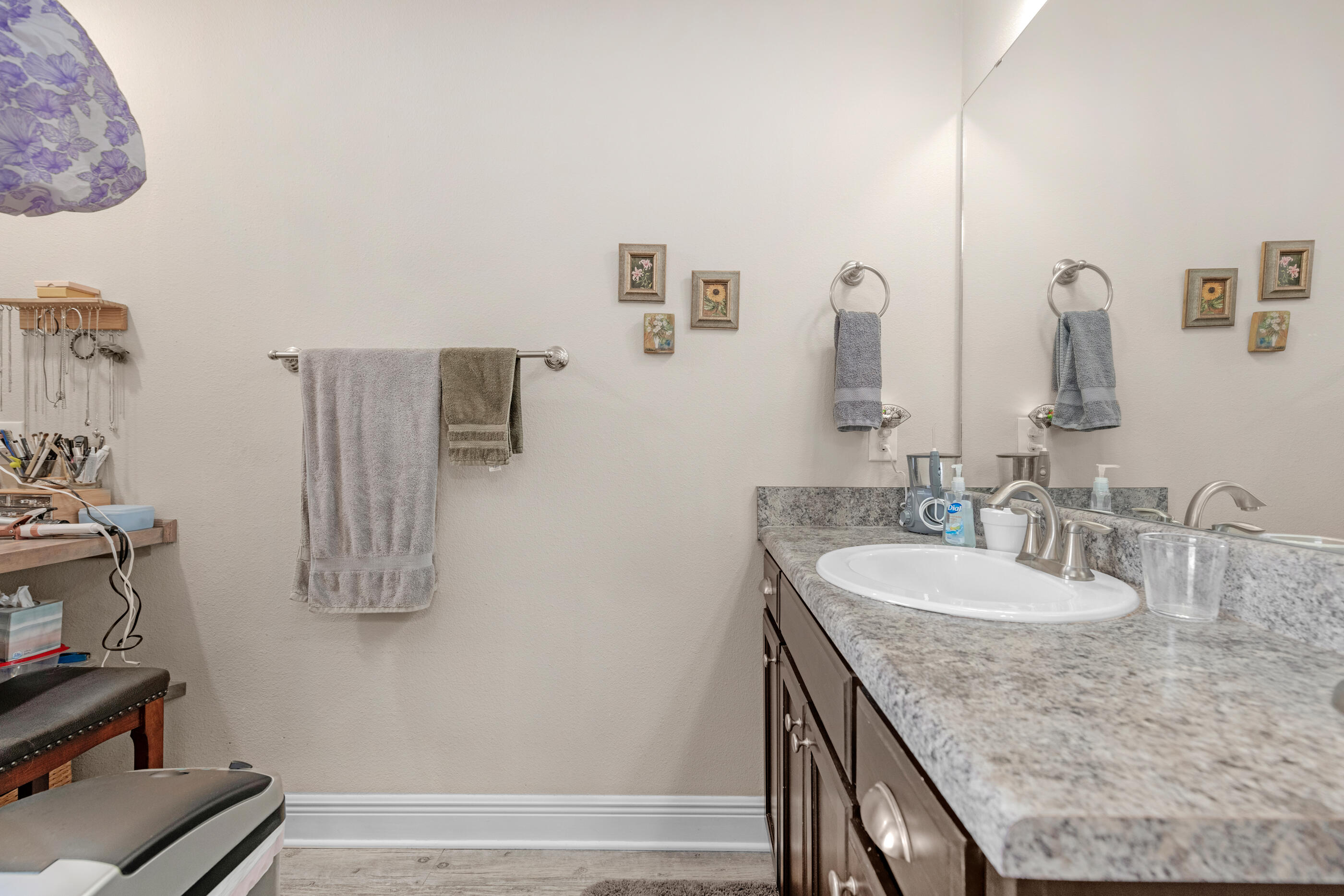 1680 Twin Pines Circle Cantonment, FL 32533 - Photo 34 of 39 a bathroom with a granite countertop sink and a mirror