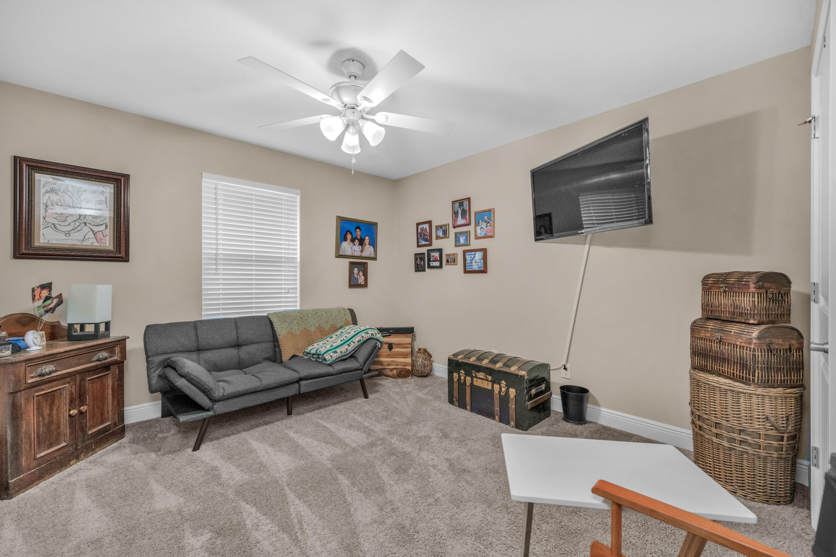 1680 Twin Pines Circle Cantonment, FL 32533 - Photo 39 of 39 a living room with furniture and a flat screen tv