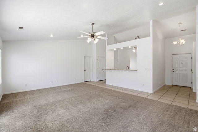 1630 East 2450th Street South, Unit 263 St. George, UT 84790 - Photo 8 of 24 Spacious living area featuring neutral carpeting and white wall finishes