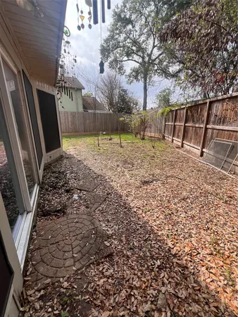 a view of backyard with trampoline