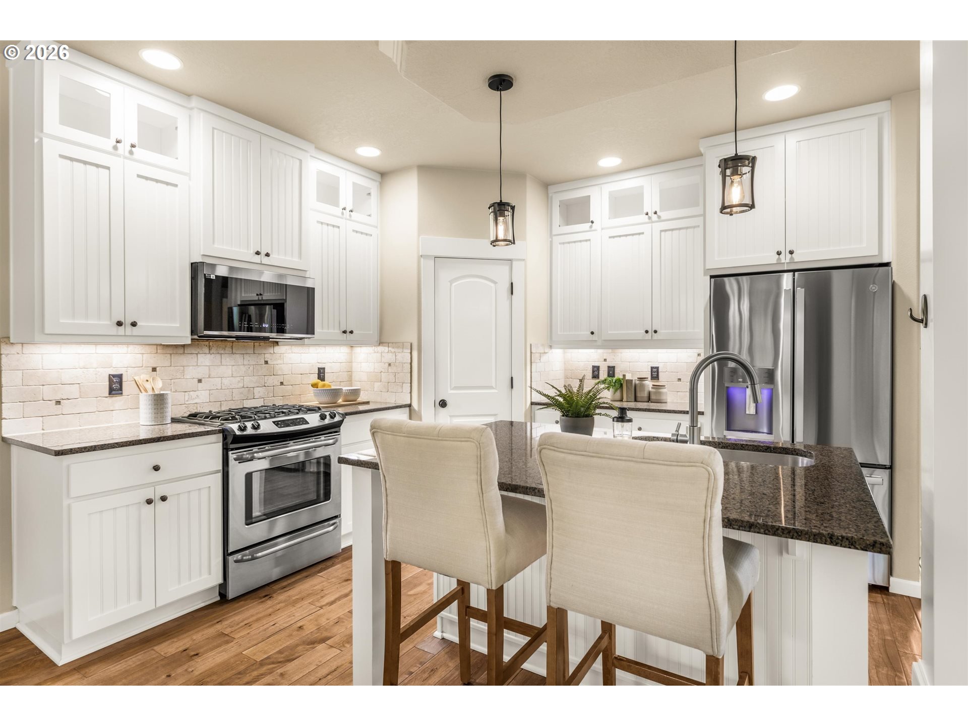16073 Southeast Pinot Road Milwaukie, OR 97267 - Photo 13 of 44 a kitchen with stainless steel appliances granite countertop a refrigerator a stove top oven a sink and dishwasher