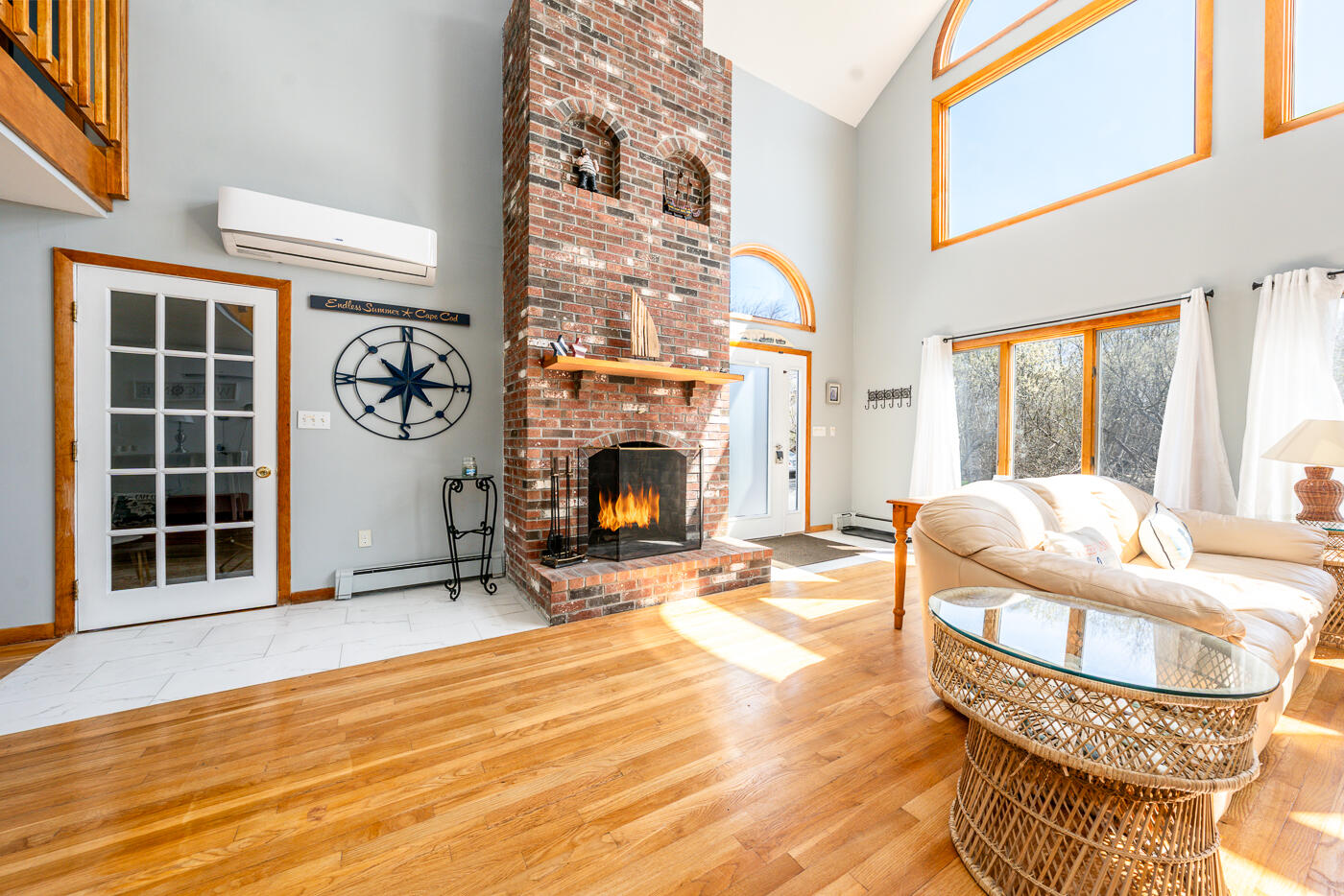 33 Island View Road Hyannis, MA 02601 - Photo 11 of 64 a living room with furniture windows and a fireplace