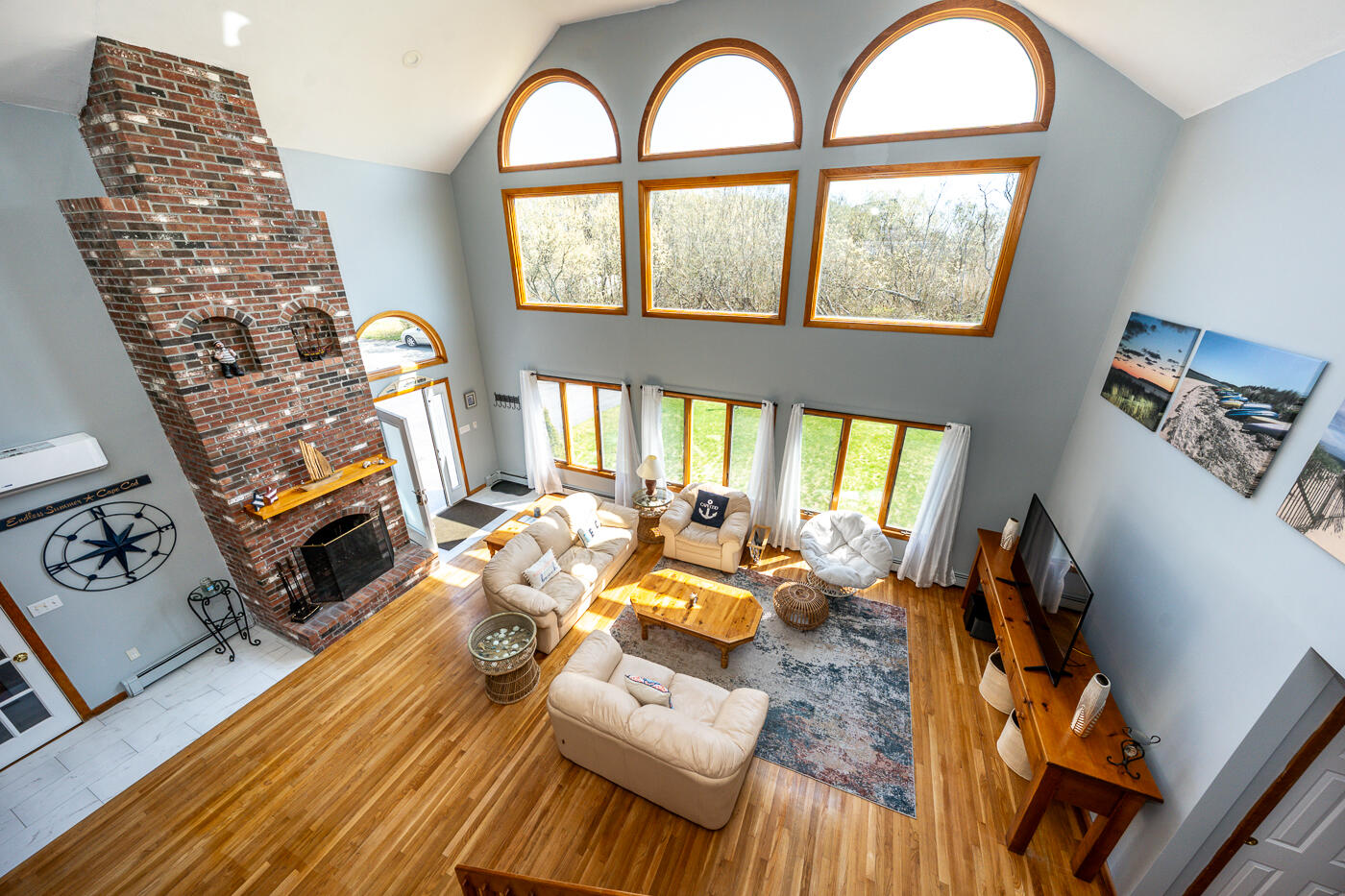 33 Island View Road Hyannis, MA 02601 - Photo 17 of 64 a living room with furniture fireplace and a large window
