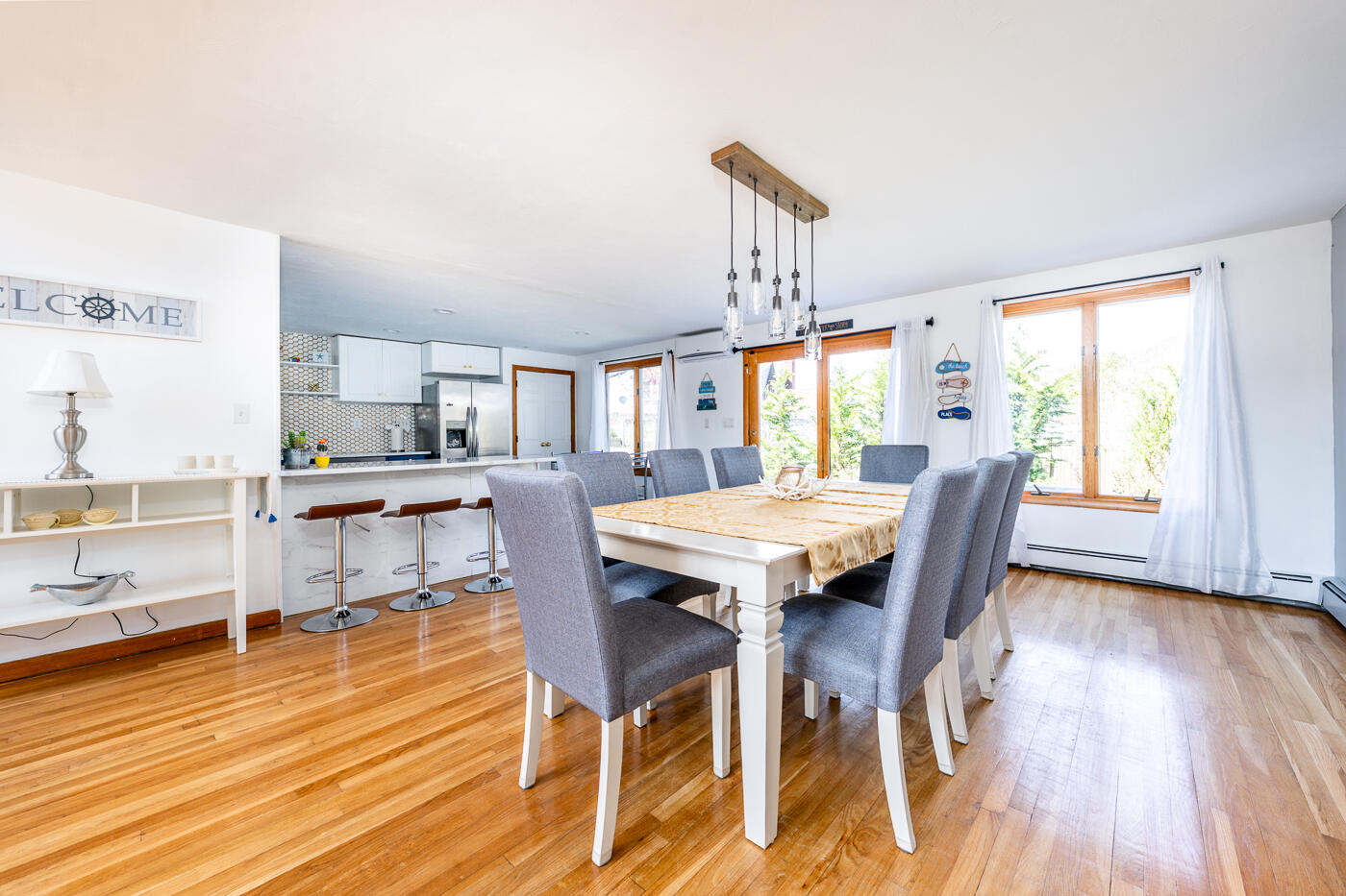 33 Island View Road Hyannis, MA 02601 - Photo 18 of 64 a view of a dining room with furniture window and wooden floor