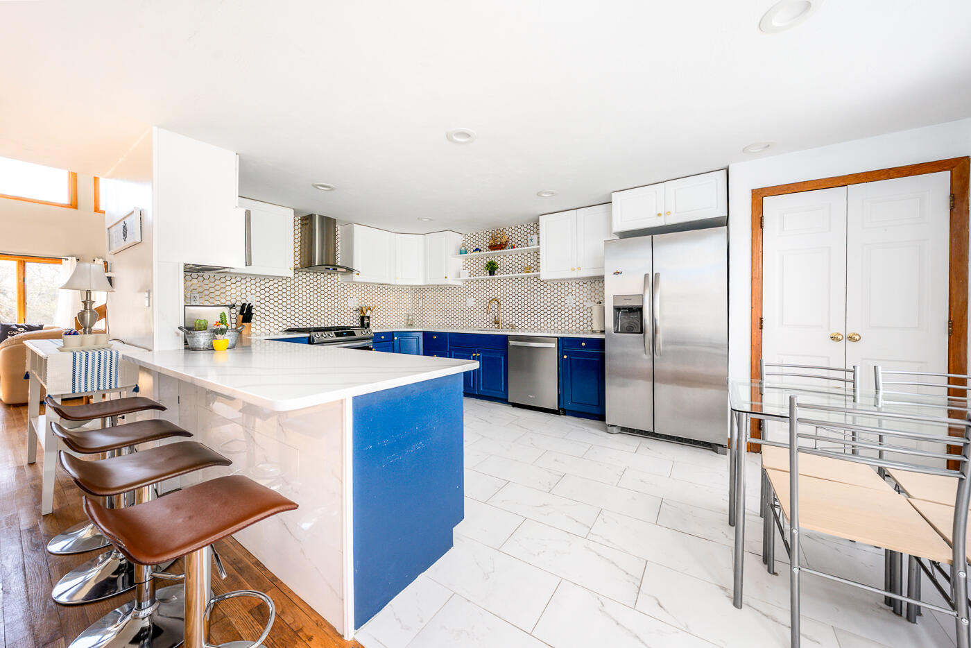 33 Island View Road Hyannis, MA 02601 - Photo 21 of 64 a kitchen with stainless steel appliances a stove a sink and a refrigerator with wooden floor