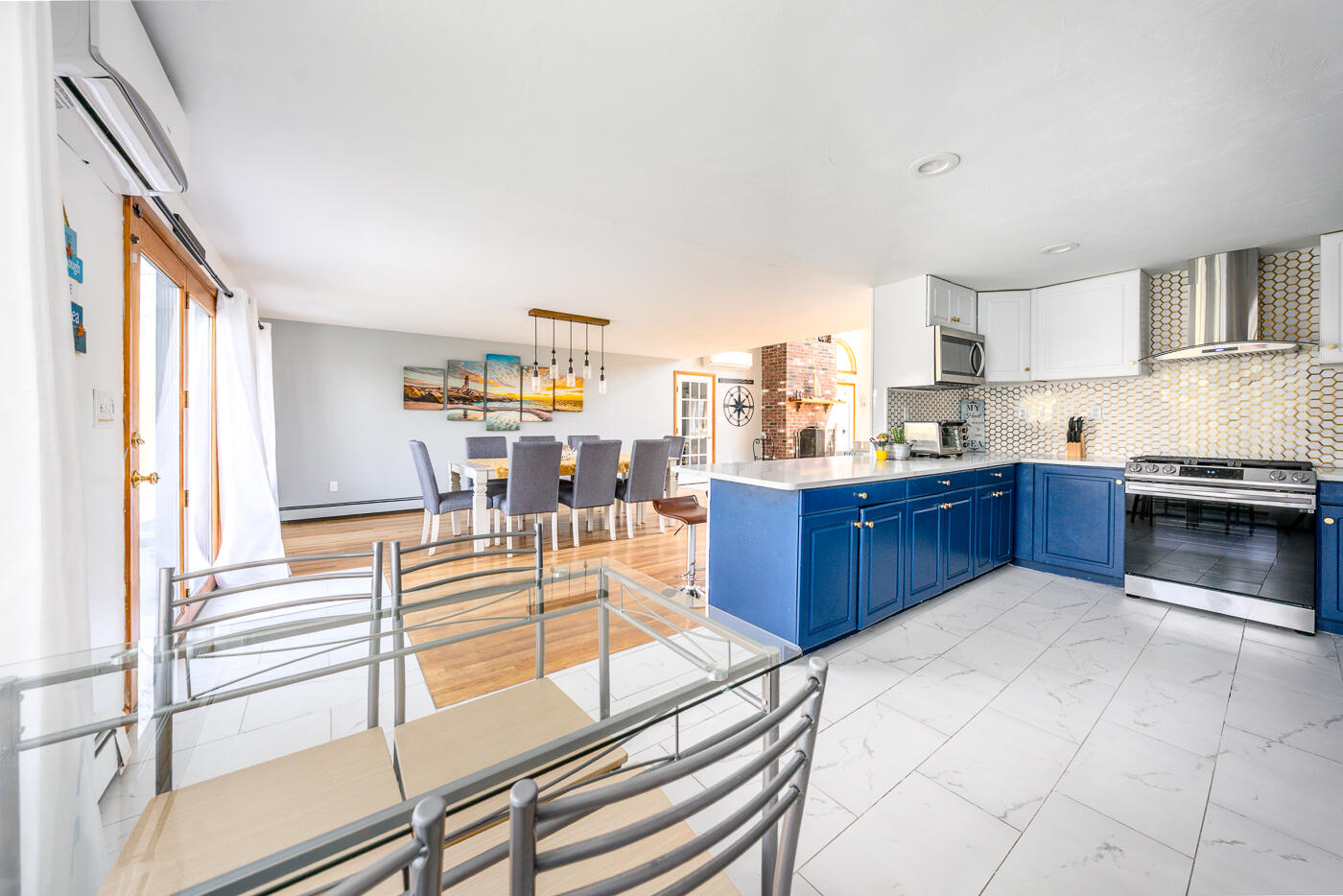 33 Island View Road Hyannis, MA 02601 - Photo 25 of 64 a living room with stainless steel appliances kitchen island granite countertop a sink and cabinets