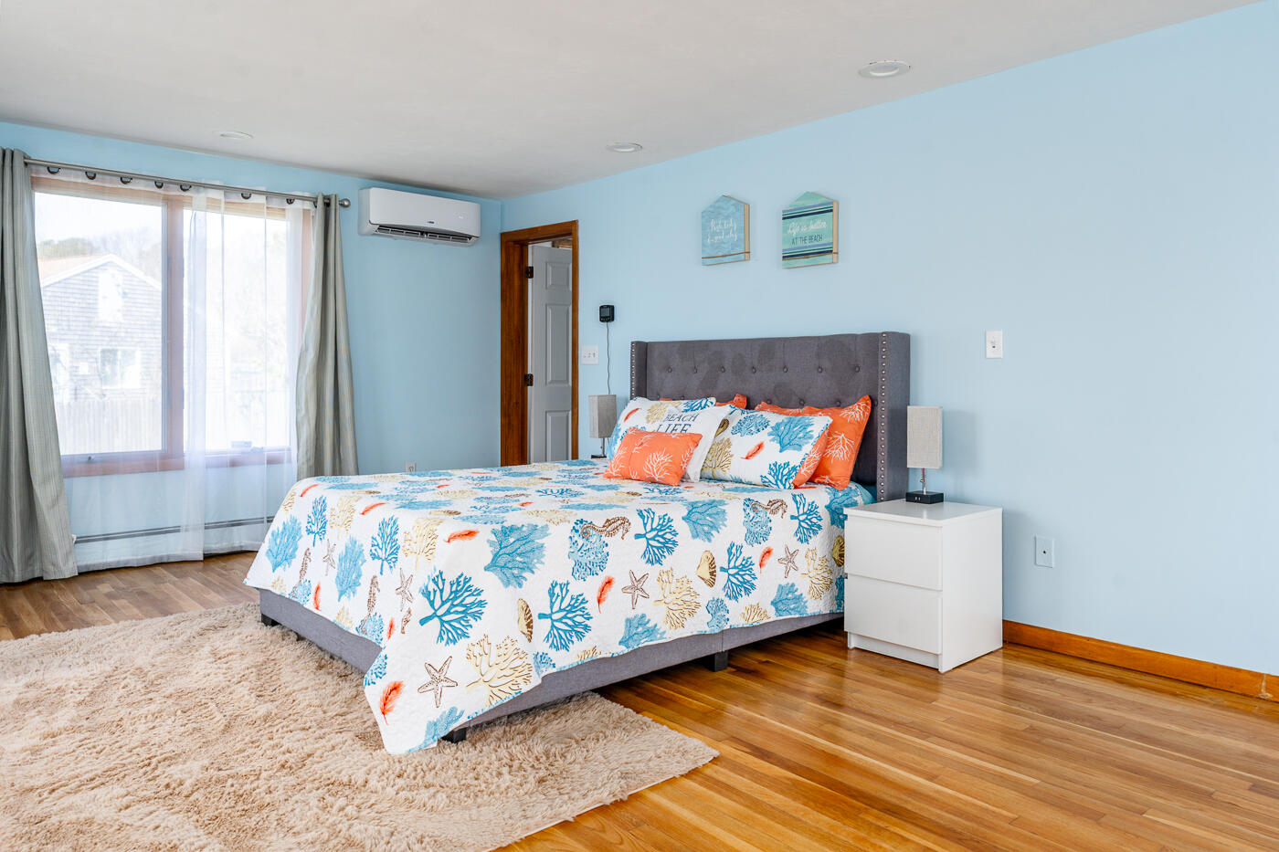 33 Island View Road Hyannis, MA 02601 - Photo 29 of 64 a bedroom with a bed and wooden floor