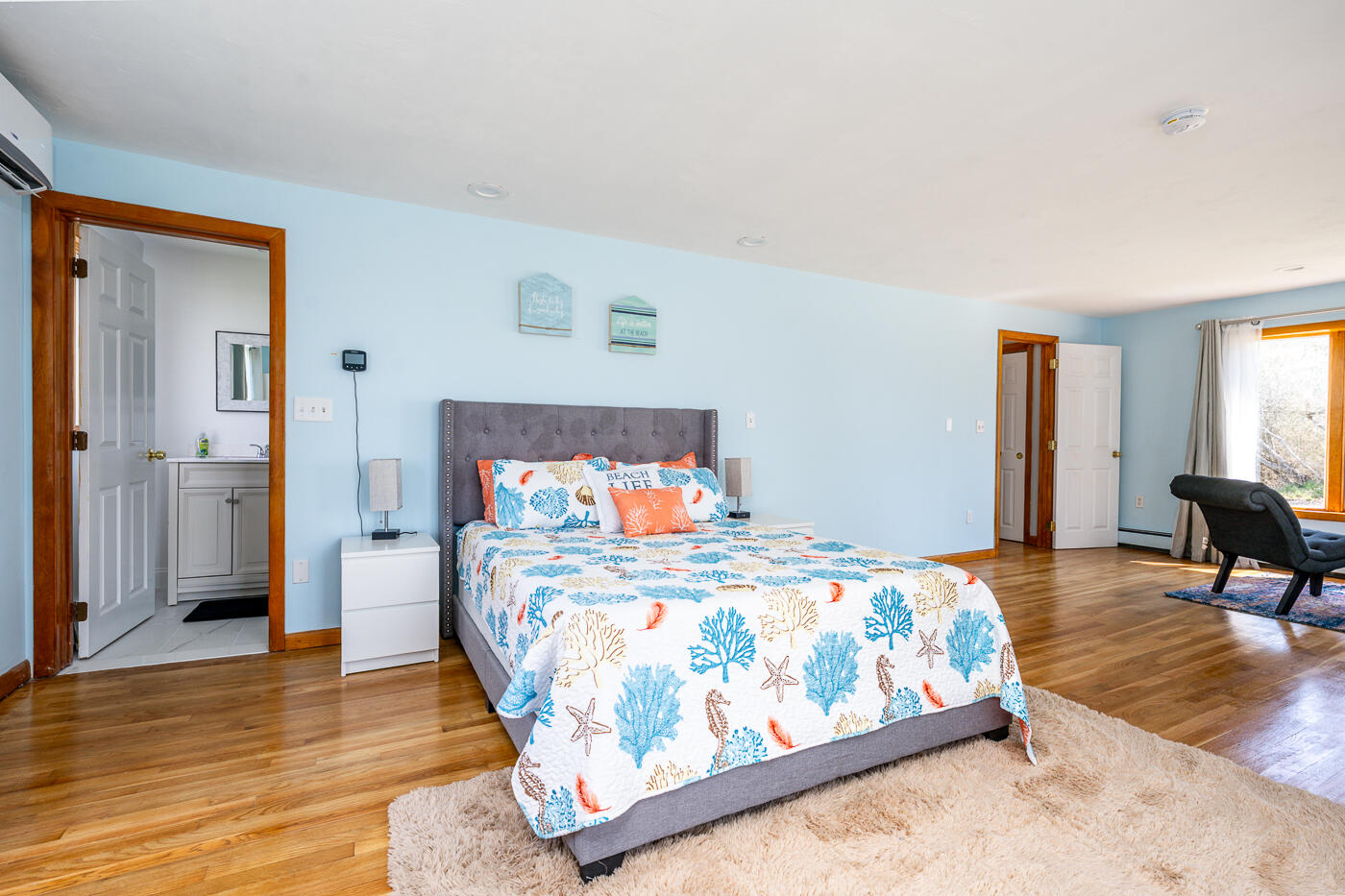 33 Island View Road Hyannis, MA 02601 - Photo 30 of 64 a bedroom with a bed and wooden floor