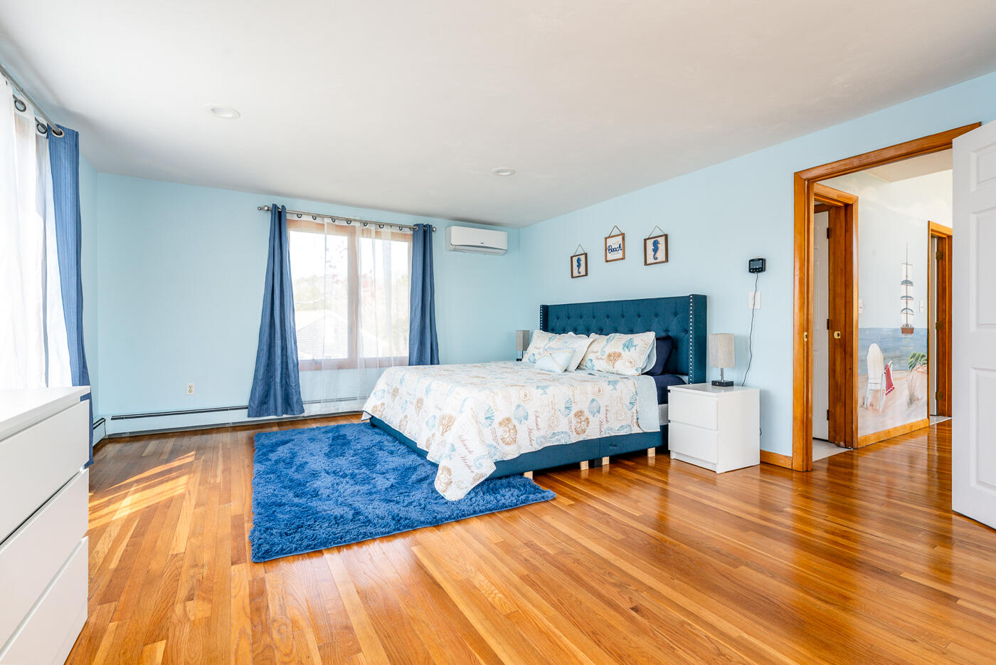 33 Island View Road Hyannis, MA 02601 - Photo 37 of 64 a bedroom with a bed and wooden floor