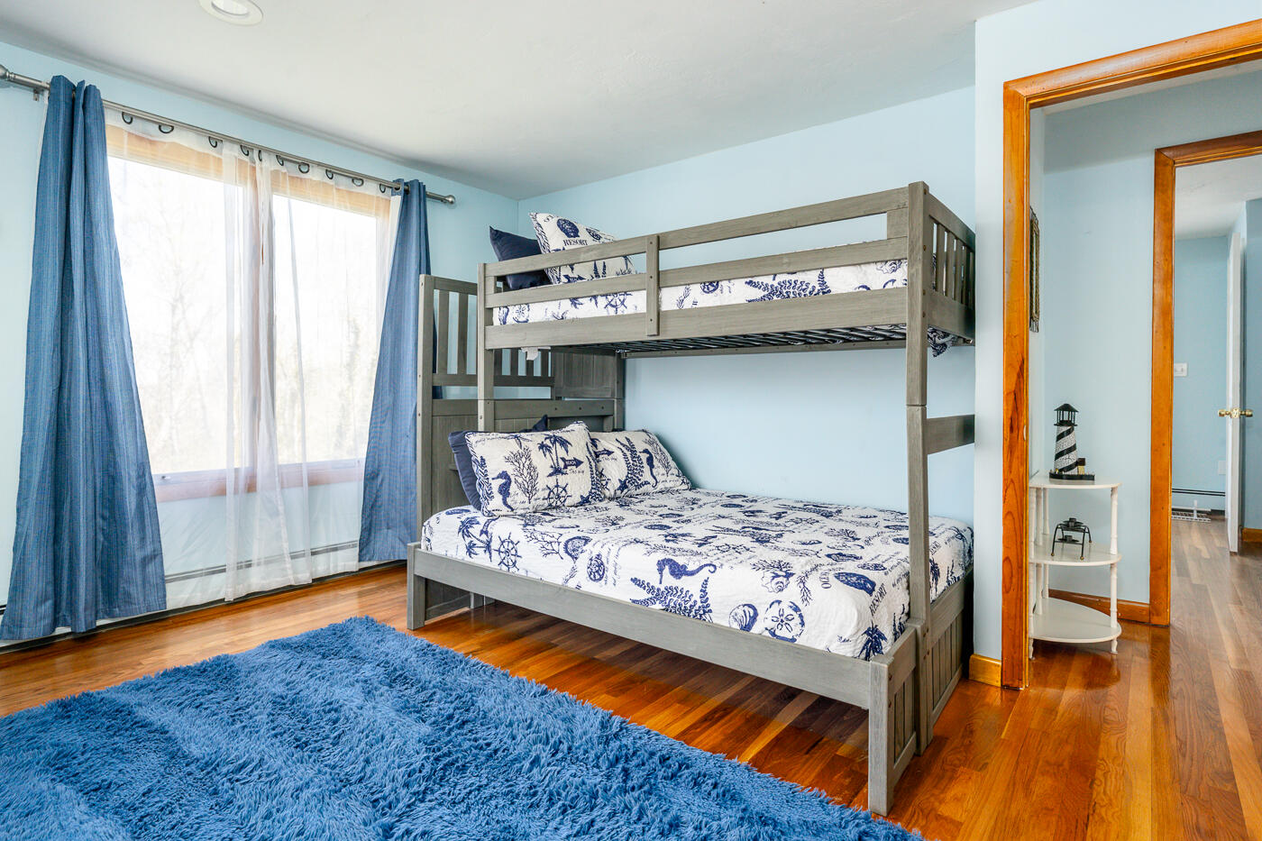 33 Island View Road Hyannis, MA 02601 - Photo 44 of 64 a bedroom with a bed and wooden floor