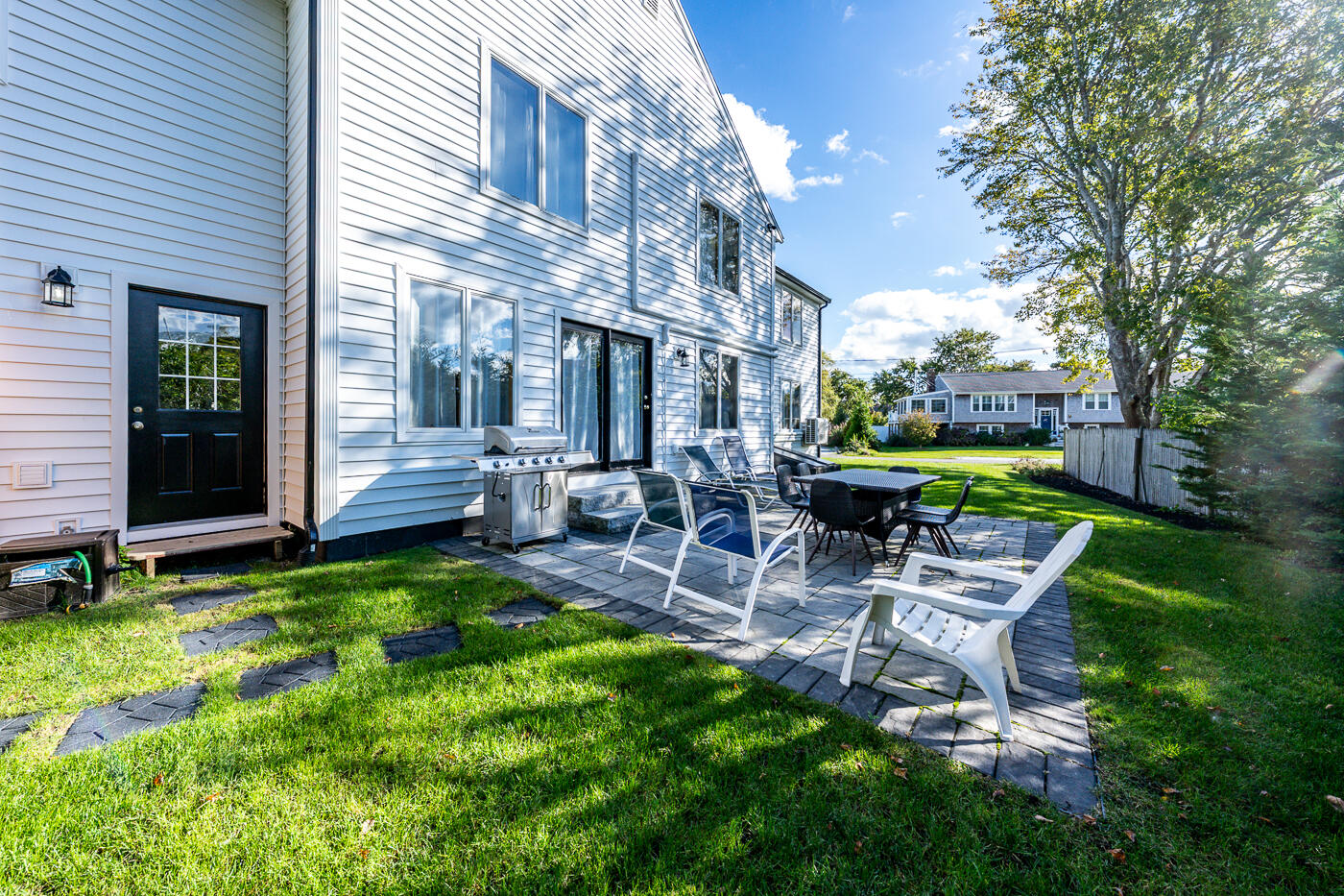 33 Island View Road Hyannis, MA 02601 - Photo 53 of 64 a view of a patio with table and chairs potted plants and large tree