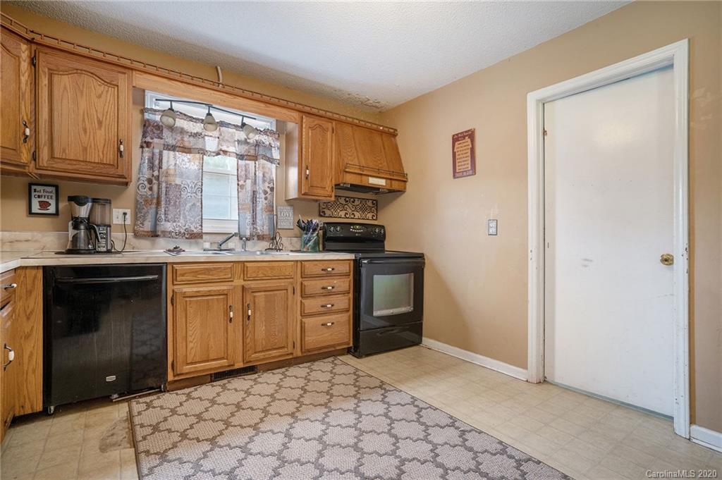 1714 East Sandy Ridge Road Monroe, NC 28112 - Photo 11 of 28 a kitchen with a sink stove and cabinets