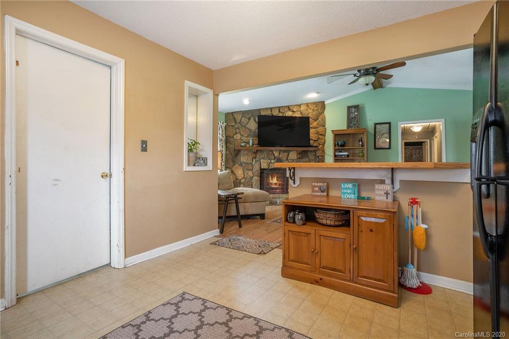1714 East Sandy Ridge Road Monroe, NC 28112 - Photo 12 of 28 a view of a livingroom with workspace and a flat screen tv