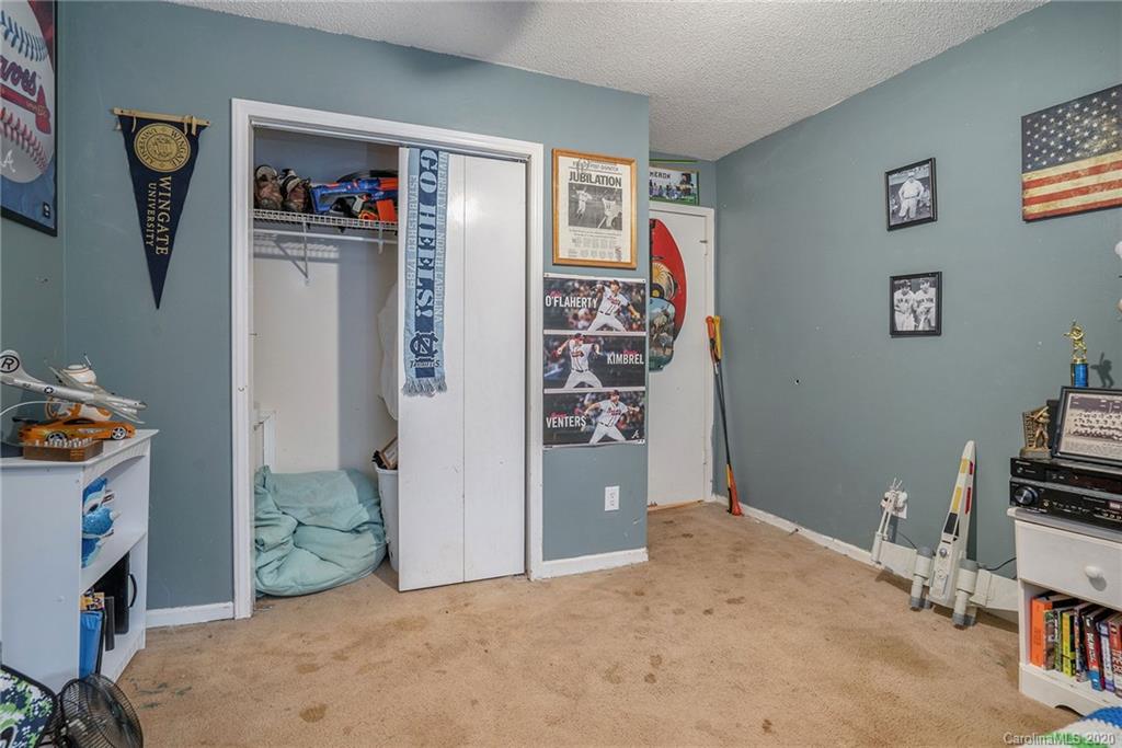 1714 East Sandy Ridge Road Monroe, NC 28112 - Photo 16 of 28 a view of a bedroom with workspace and toys