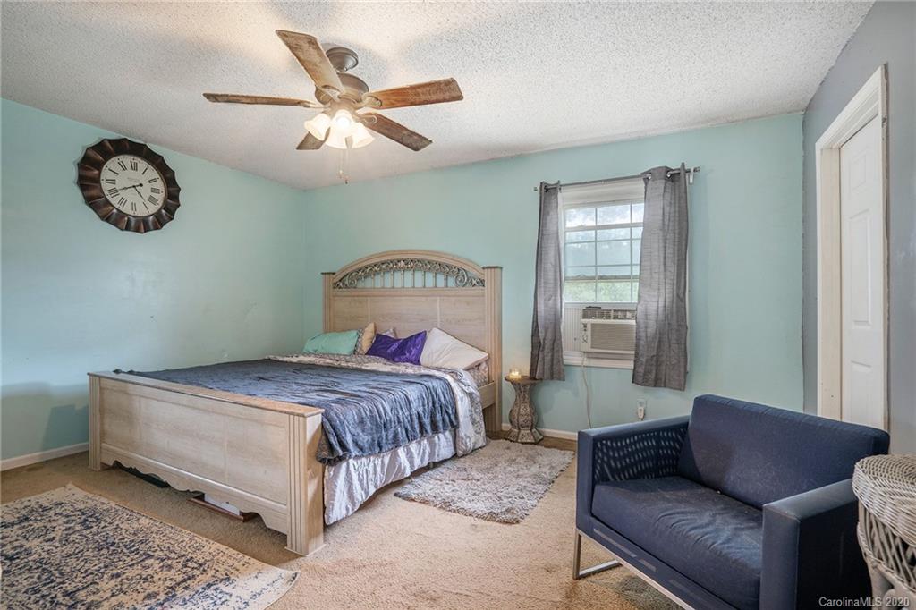 1714 East Sandy Ridge Road Monroe, NC 28112 - Photo 20 of 28 a bedroom with a bed couch and a window