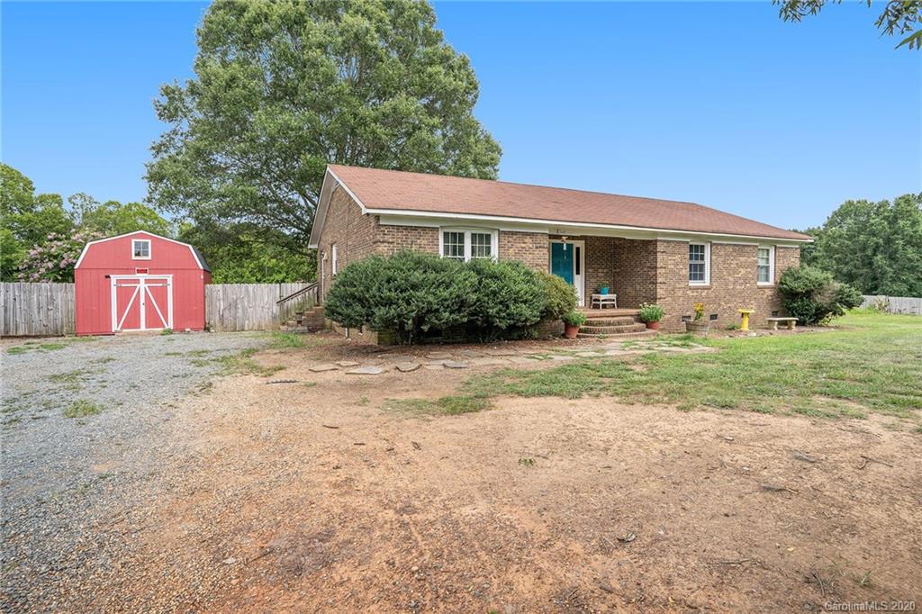 1714 East Sandy Ridge Road Monroe, NC 28112 - Photo 3 of 28 a front view of a house with garden