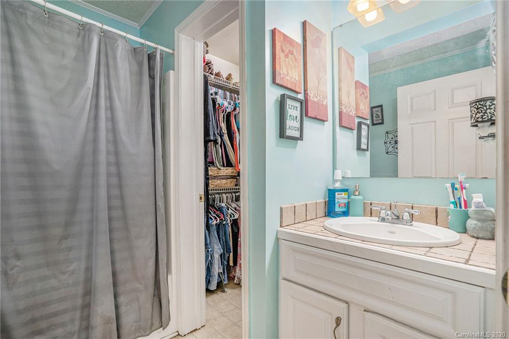 1714 East Sandy Ridge Road Monroe, NC 28112 - Photo 23 of 28 a bathroom with a sink toilet and shower