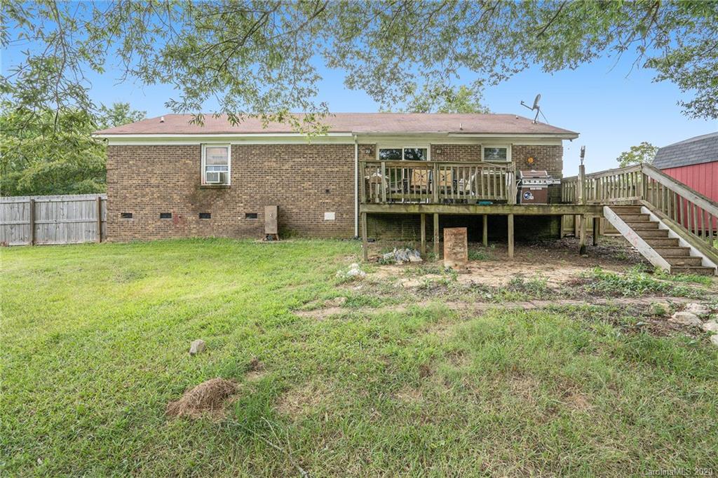 1714 East Sandy Ridge Road Monroe, NC 28112 - Photo 24 of 28 a view of a house with pool and a yard
