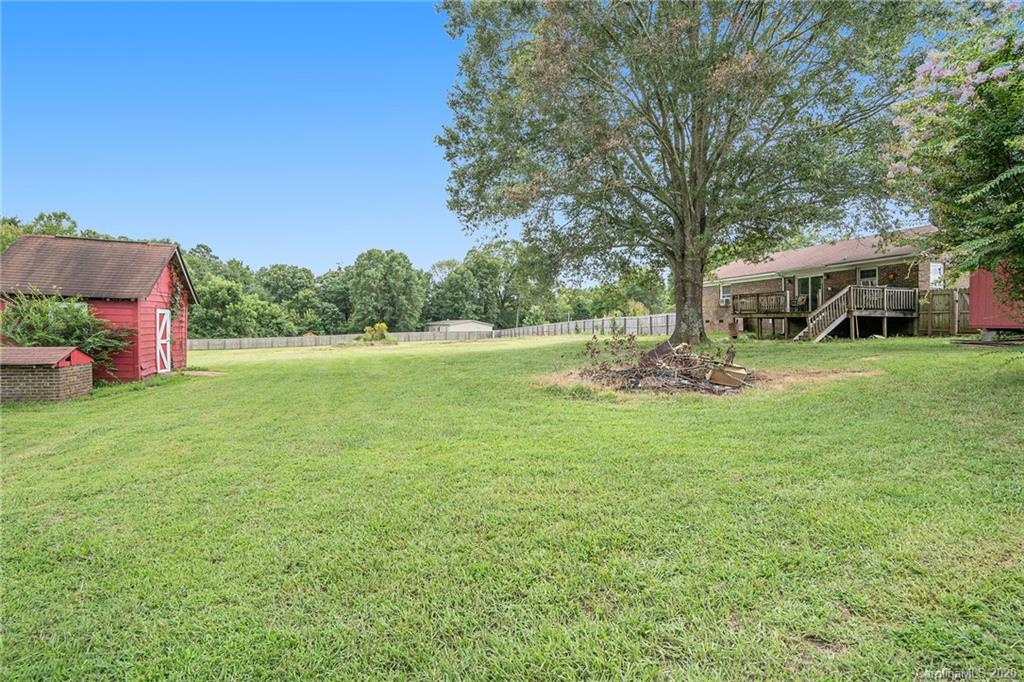 1714 East Sandy Ridge Road Monroe, NC 28112 - Photo 25 of 28 a view of a patio with a yard