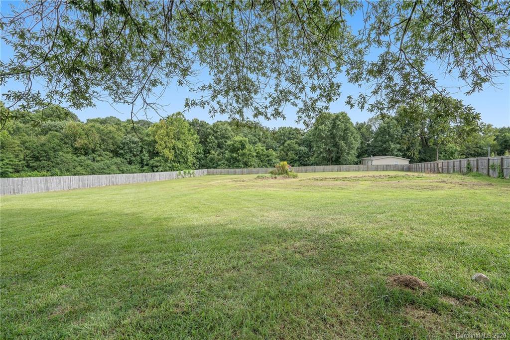 1714 East Sandy Ridge Road Monroe, NC 28112 - Photo 27 of 28 a view of a field with an outdoor space