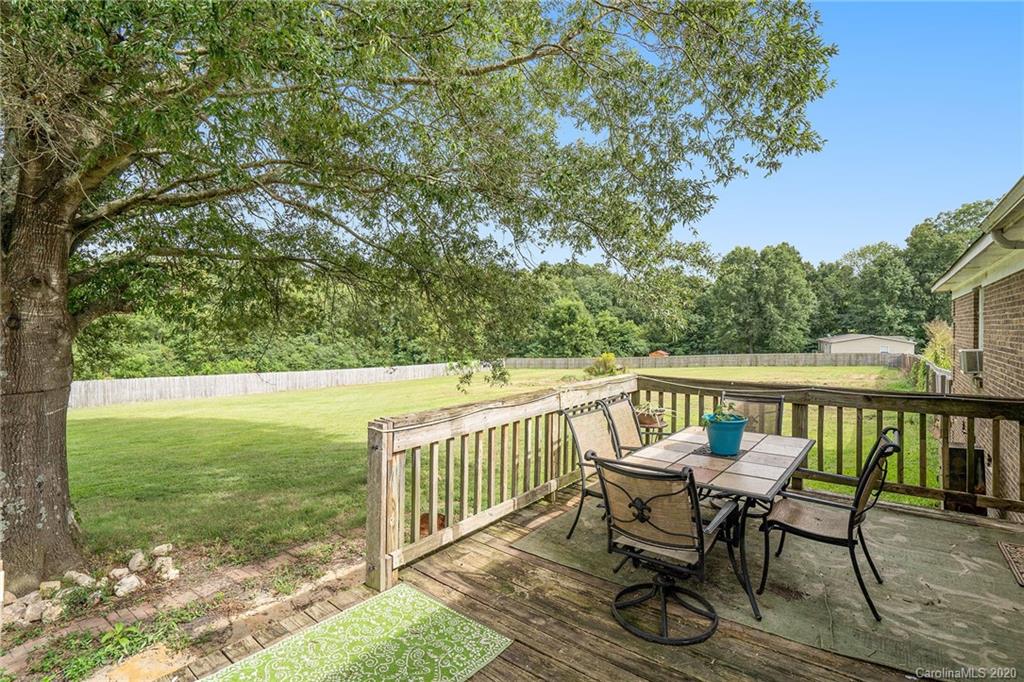 1714 East Sandy Ridge Road Monroe, NC 28112 - Photo 28 of 28 a view of a two chairs and table in the balcony