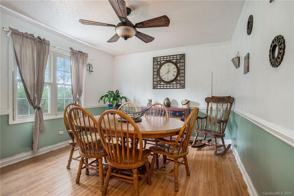 1714 East Sandy Ridge Road Monroe, NC 28112 - Photo 4 of 28 a view of a dining room with furniture window and wooden floor