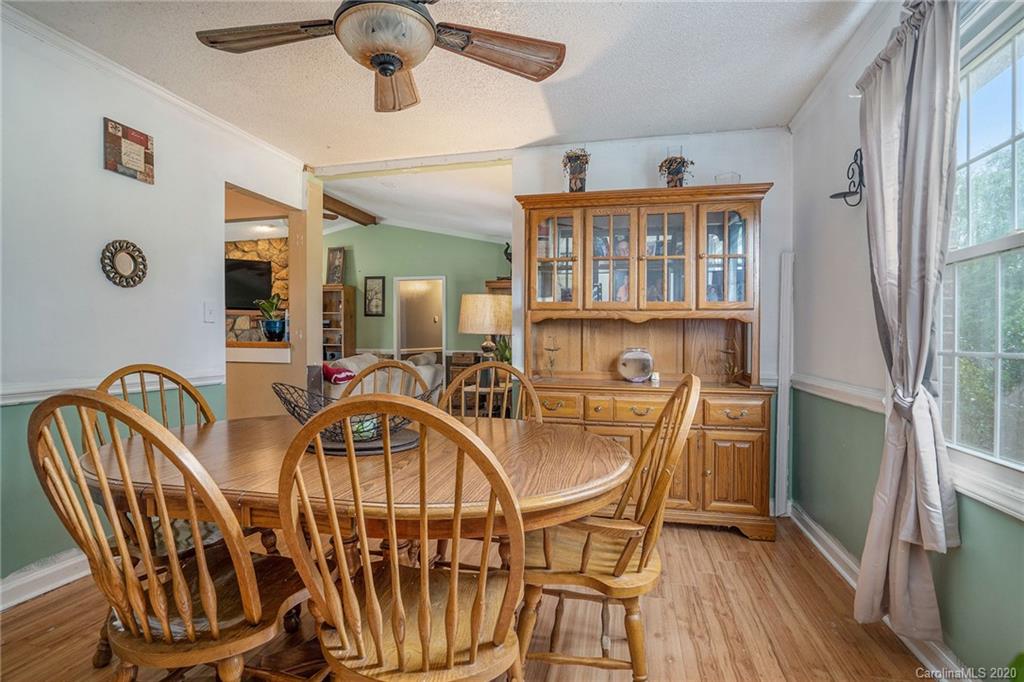 1714 East Sandy Ridge Road Monroe, NC 28112 - Photo 5 of 28 a view of a dining room with furniture and wooden floor