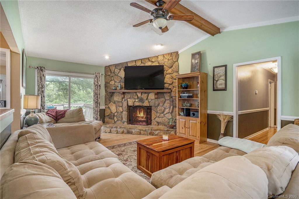 1714 East Sandy Ridge Road Monroe, NC 28112 - Photo 6 of 28 a living room with fireplace furniture and a flat screen tv